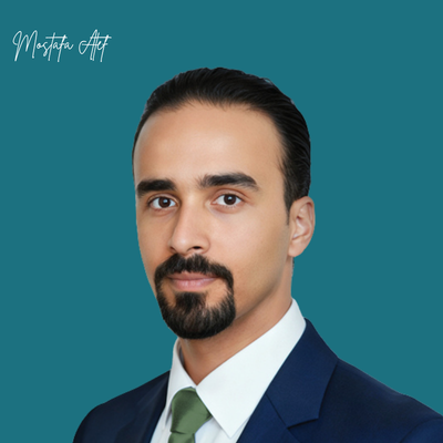 Head-and-shoulders portrait of a man in a navy suit, white shirt, and green tie, against a teal background; logo 'Mostafa Alt' in the corner.